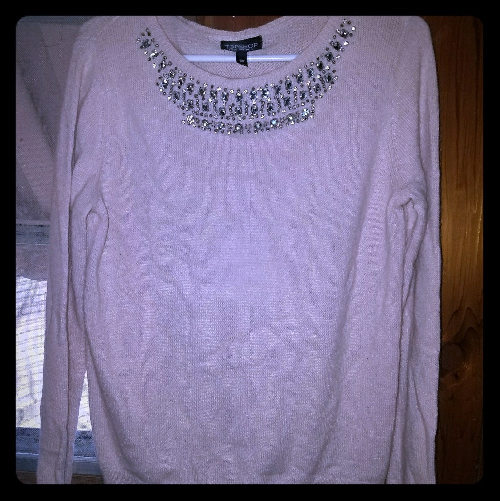 Light pink sweater with jeweled neckline